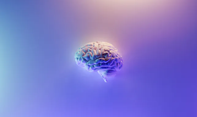 Imagem com fundo degradê azul, roxo e branco, com um cérebro no centro.